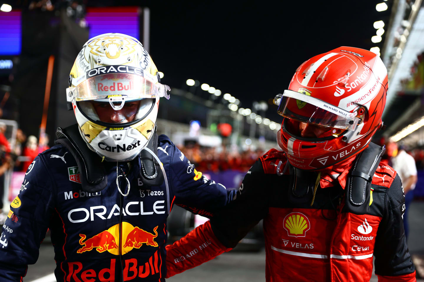 JEDDAH, SAUDI ARABIA - MARCH 27: Race winner Max Verstappen of the Netherlands and Oracle Red Bull Racing and Second placed Charles Leclerc of Monaco and Ferrari talk in parc ferme during the F1 Grand Prix of Saudi Arabia at the Jeddah Corniche Circuit on March 27, 2022 in Jeddah, Saudi Arabia. (Photo by Mark Thompson/Getty Images)