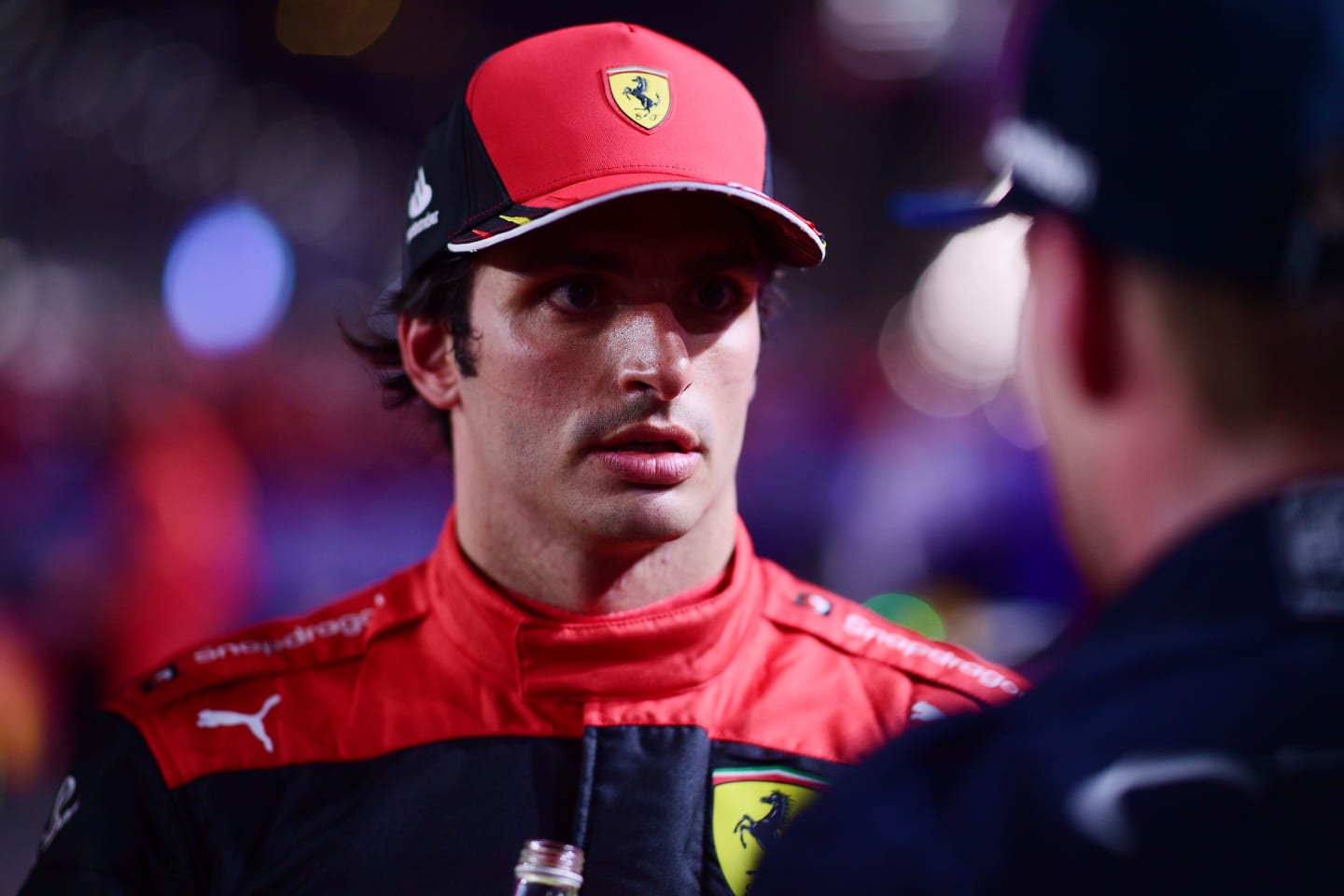 JEDDAH, SAUDI ARABIA - MARCH 27: Third placed Carlos Sainz of Spain and Ferrari talks with Race winner Max Verstappen of the Netherlands and Oracle Red Bull Racing in parc ferme during the F1 Grand Prix of Saudi Arabia at the Jeddah Corniche Circuit on March 27, 2022 in Jeddah, Saudi Arabia. (Photo by Mario Renzi - Formula 1/Formula 1 via Getty Images)