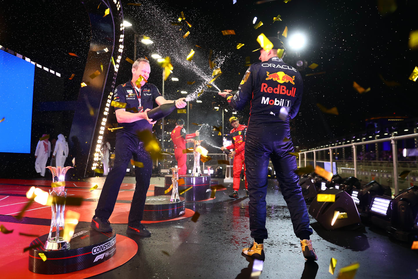JEDDAH, SAUDI ARABIA - MARCH 27: Race winner Max Verstappen of the Netherlands and Oracle Red Bull Racing and Red Bull Racing Head of Car Engineering Paul Monaghan celebrate on the podium during the F1 Grand Prix of Saudi Arabia at the Jeddah Corniche Circuit on March 27, 2022 in Jeddah, Saudi Arabia. (Photo by Dan Istitene - Formula 1/Formula 1 via Getty Images)