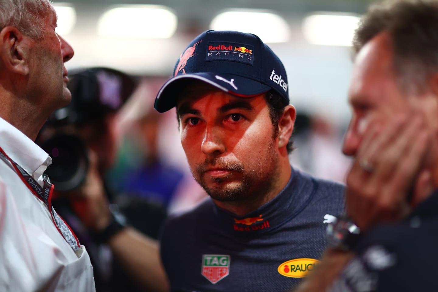 JEDDAH, SAUDI ARABIA - MARCH 27: Sergio Perez of Mexico and Oracle Red Bull Racing talks with Red