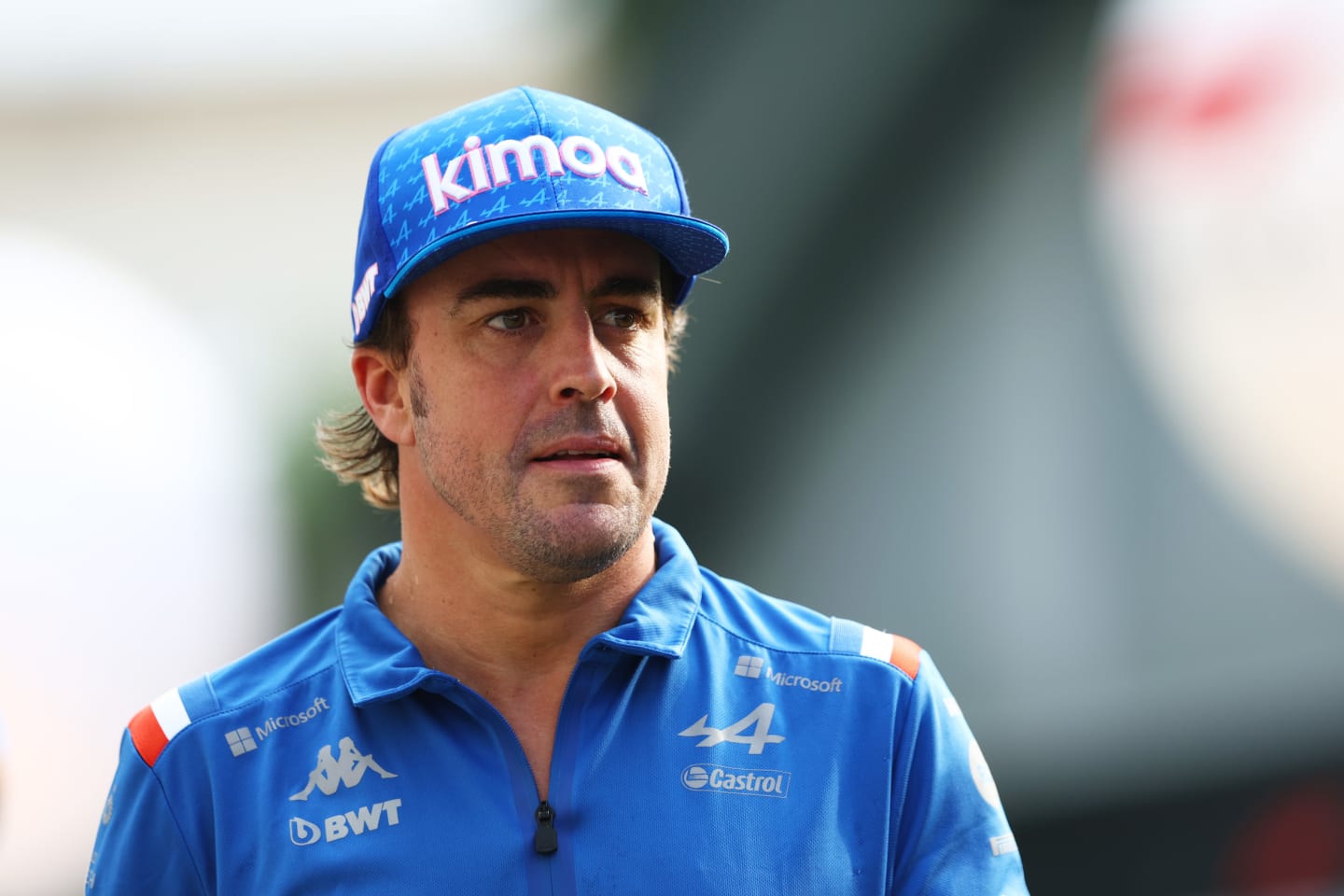 SINGAPORE, SINGAPORE - SEPTEMBER 30: Fernando Alonso of Spain and Alpine F1 walks in the Paddock prior to practice ahead of the F1 Grand Prix of Singapore at Marina Bay Street Circuit on September 30, 2022 in Singapore, Singapore. (Photo by Clive Rose/Getty Images,)