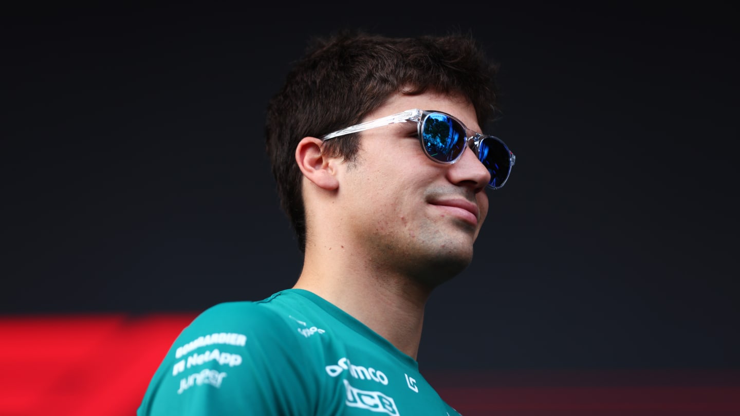 SINGAPORE, SINGAPORE - SEPTEMBER 30: Lance Stroll of Canada and Aston Martin F1 Team greets fans on the fan stage prior to practice ahead of the F1 Grand Prix of Singapore at Marina Bay Street Circuit on September 30, 2022 in Singapore, Singapore. (Photo by Dan Istitene - Formula 1/Formula 1 via Getty Images)