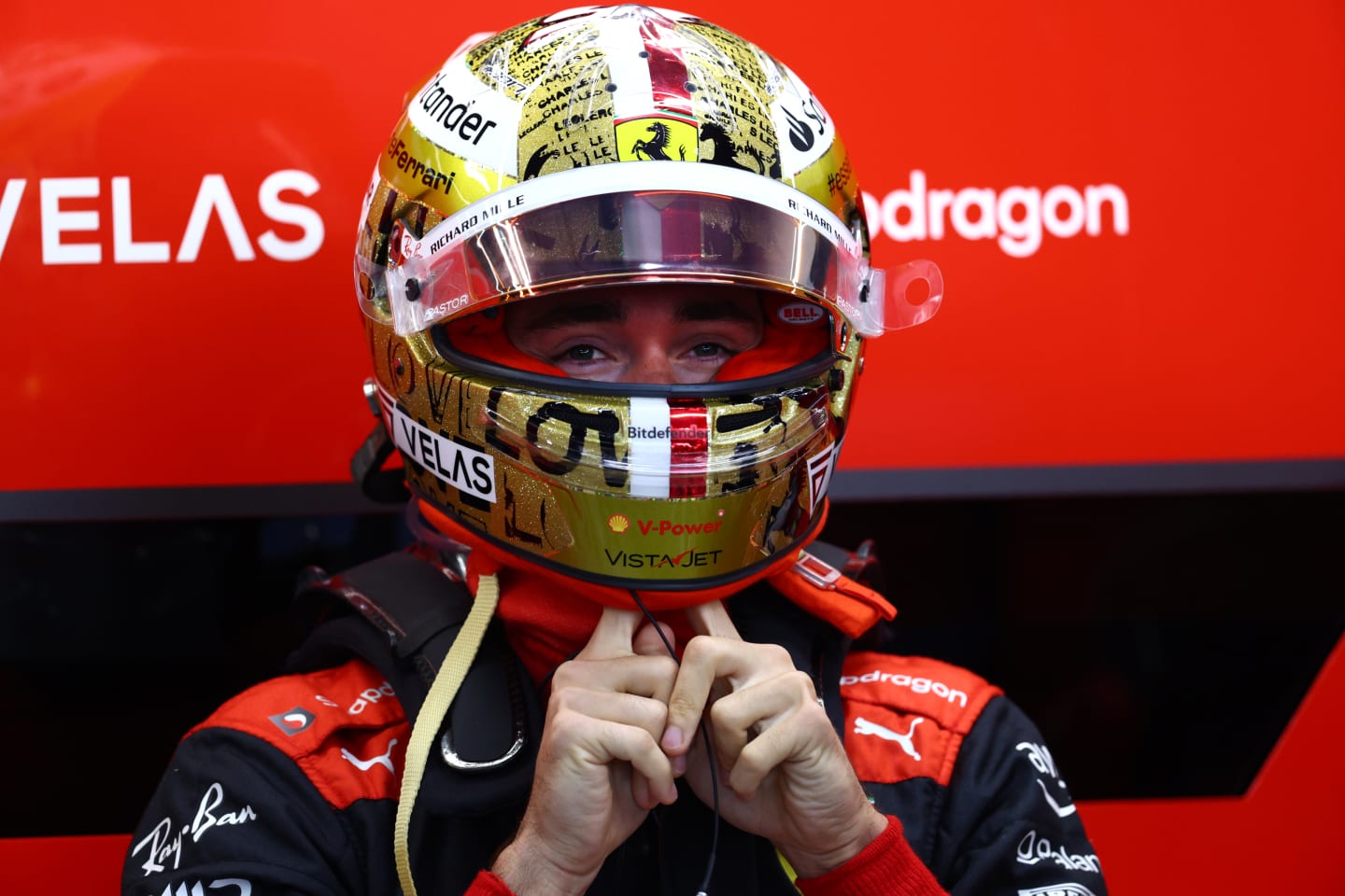 SINGAPORE, SINGAPORE - SEPTEMBER 30: Charles Leclerc of Monaco and Ferrari prepares to drive in the garage during practice ahead of the F1 Grand Prix of Singapore at Marina Bay Street Circuit on September 30, 2022 in Singapore, Singapore. (Photo by Clive Rose/Getty Images,)