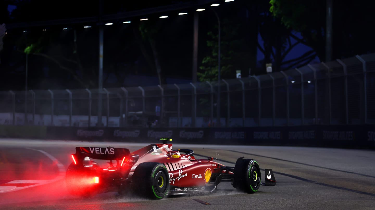 SINGAPORE, SINGAPORE - OCTOBER 01: Carlos Sainz of Spain driving (55) the Ferrari F1-75 on track