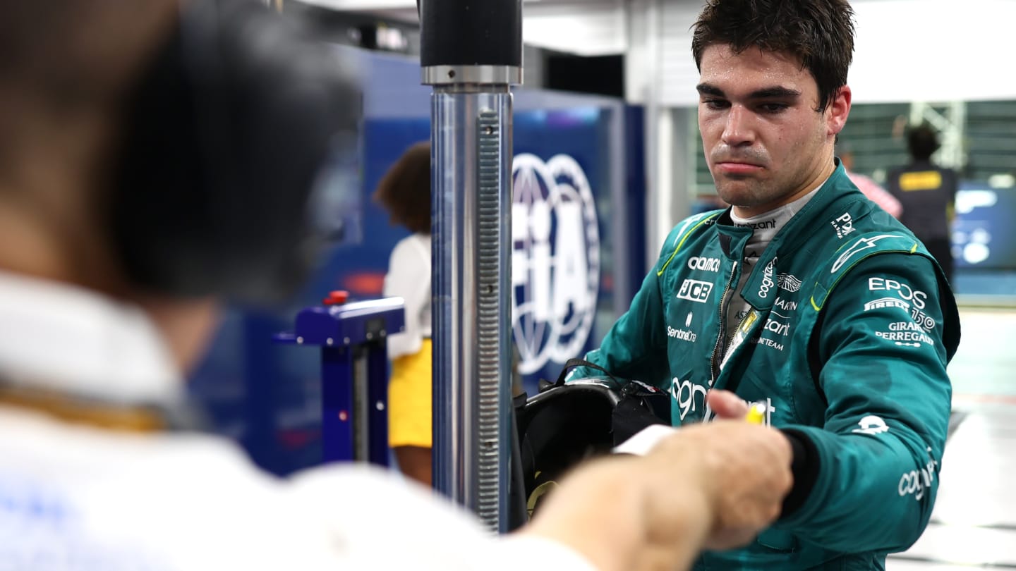 SINGAPORE, SINGAPORE - OCTOBER 01: Twelfth placed qualifier Lance Stroll of Canada and Aston Martin F1 Team is weighed in the FIA garage during qualifying ahead of the F1 Grand Prix of Singapore at Marina Bay Street Circuit on October 01, 2022 in Singapore, Singapore. (Photo by Dan Istitene - Formula 1/Formula 1 via Getty Images)