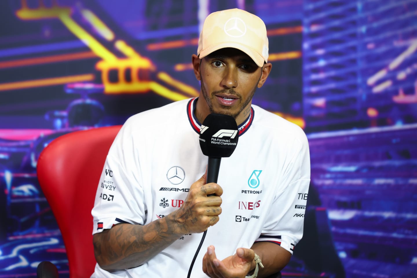SINGAPORE, SINGAPORE - OCTOBER 01: Third placed qualifier Lewis Hamilton of Great Britain and Mercedes attends the press conference after qualifying ahead of the F1 Grand Prix of Singapore at Marina Bay Street Circuit on October 01, 2022 in Singapore, Singapore. (Photo by Dan Istitene/Getty Images)