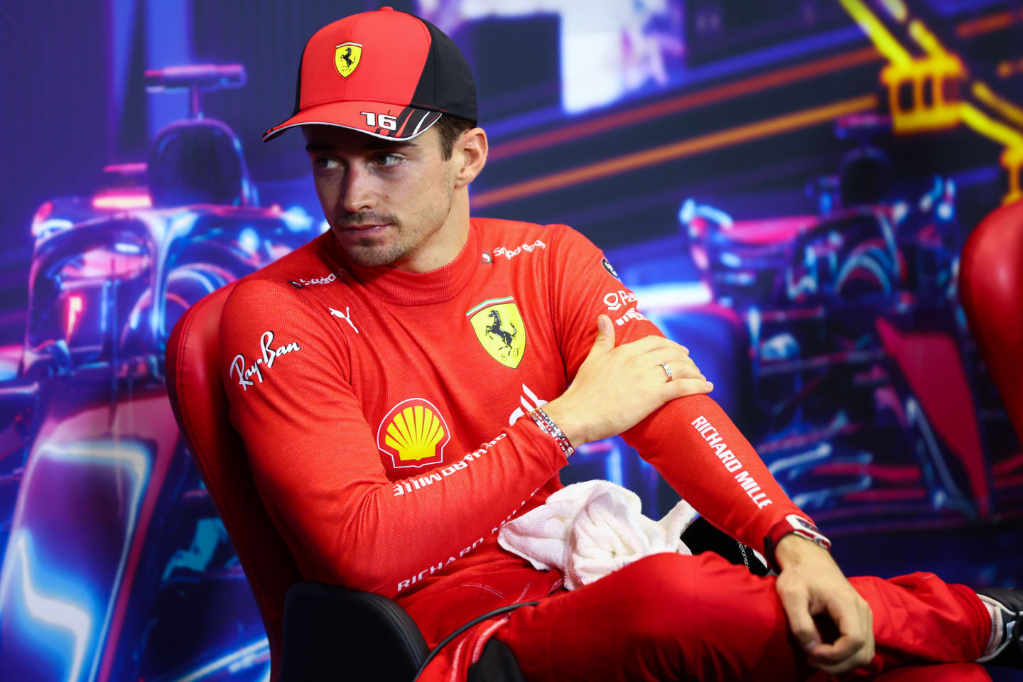 SINGAPORE, SINGAPORE - OCTOBER 01: Pole position qualifier Charles Leclerc of Monaco and Ferrari attends the press conference after qualifying ahead of the F1 Grand Prix of Singapore at Marina Bay Street Circuit on October 01, 2022 in Singapore, Singapore. (Photo by Dan Istitene/Getty Images)
