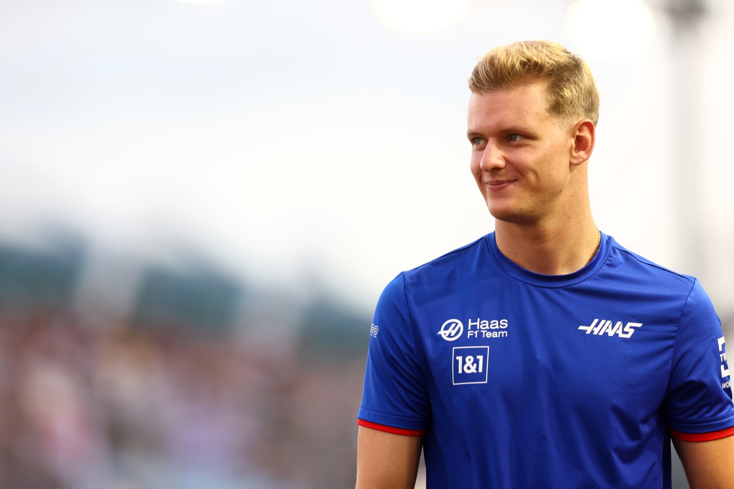 SINGAPORE, SINGAPORE - OCTOBER 02: Mick Schumacher of Germany and Haas F1 looks on from the drivers parade prior to the F1 Grand Prix of Singapore at Marina Bay Street Circuit on October 02, 2022 in Singapore, Singapore. (Photo by Mark Thompson/Getty Images,)