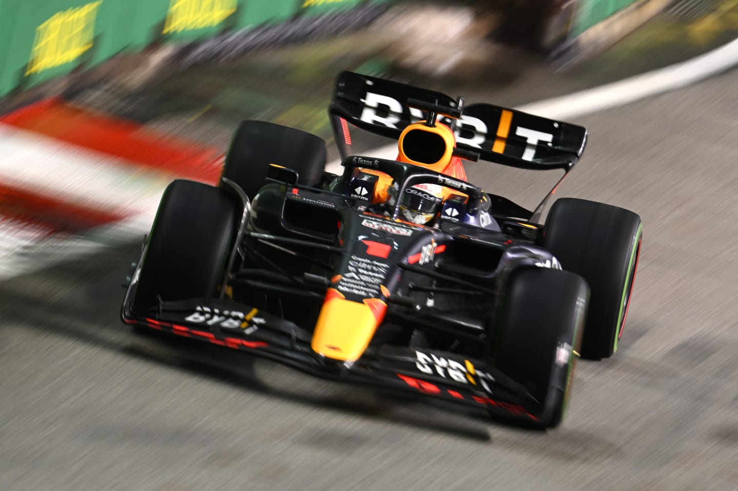 SINGAPORE, SINGAPORE - OCTOBER 02: Max Verstappen of the Netherlands driving the (1) Oracle Red Bull Racing RB18 on track during the F1 Grand Prix of Singapore at Marina Bay Street Circuit on October 02, 2022 in Singapore, Singapore. (Photo by Clive Mason/Getty Images,)