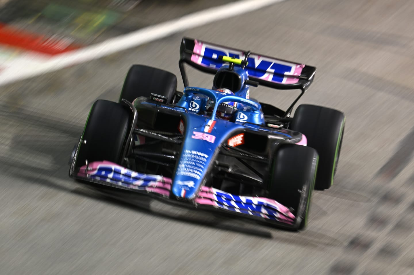 SINGAPORE, SINGAPORE - OCTOBER 02: Esteban Ocon of France driving the (31) Alpine F1 A522 Renault on track during the F1 Grand Prix of Singapore at Marina Bay Street Circuit on October 02, 2022 in Singapore, Singapore. (Photo by Clive Mason/Getty Images,)