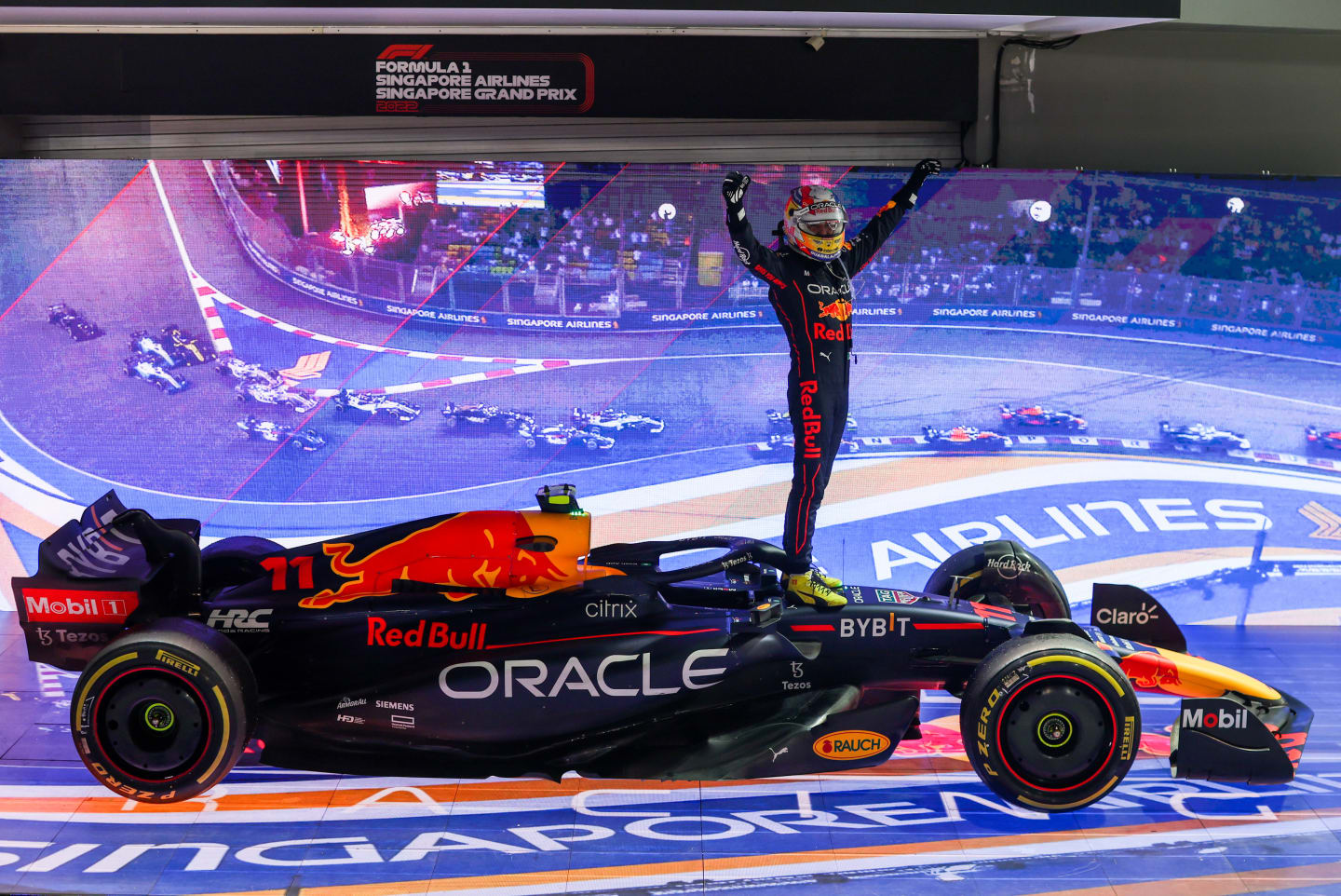 SINGAPORE, SINGAPORE - OCTOBER 02: Sergio Perez of Mexico and Red Bull Racing celebrates finishing