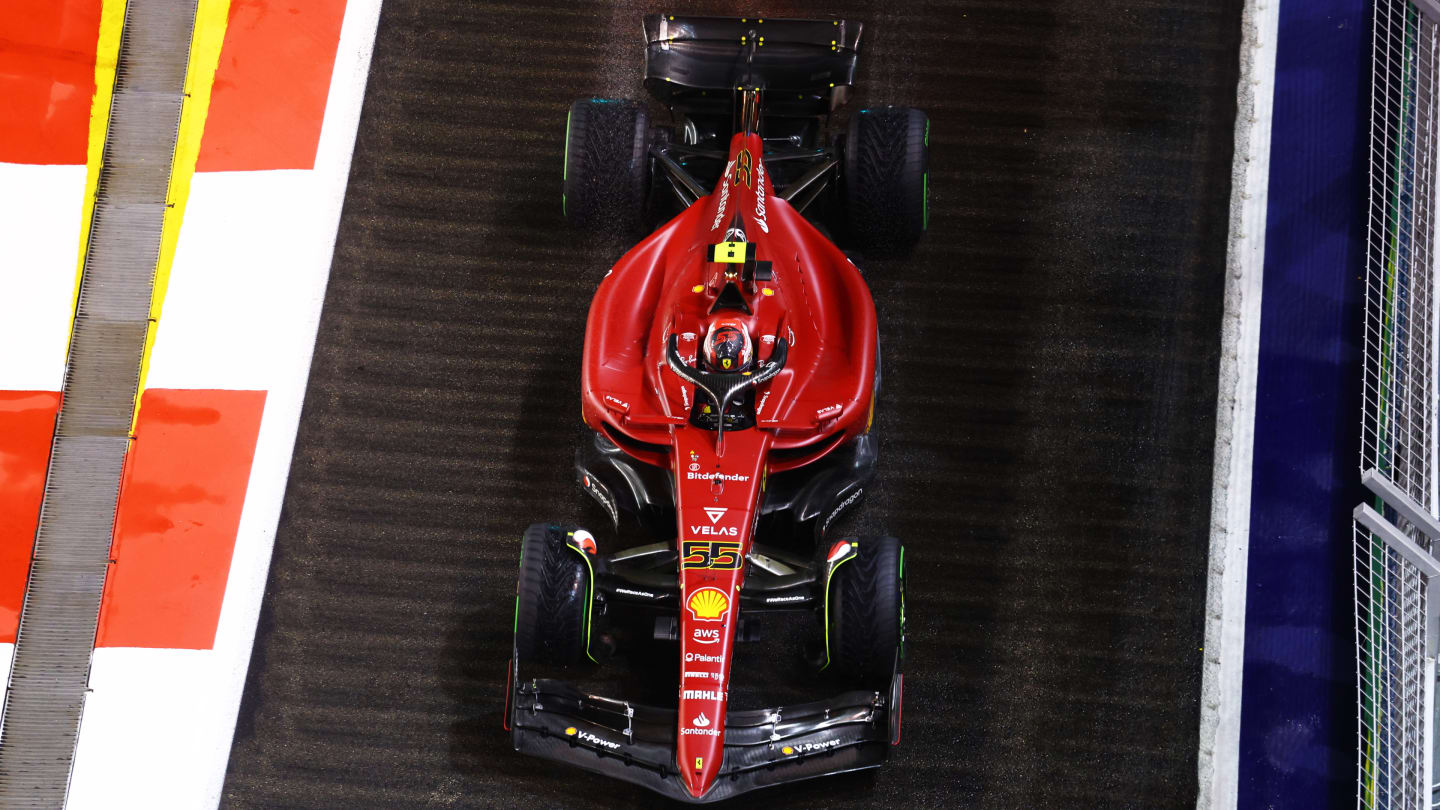 SINGAPORE, SINGAPORE - OCTOBER 02: Carlos Sainz of Spain driving (55) the Ferrari F1-75 on track