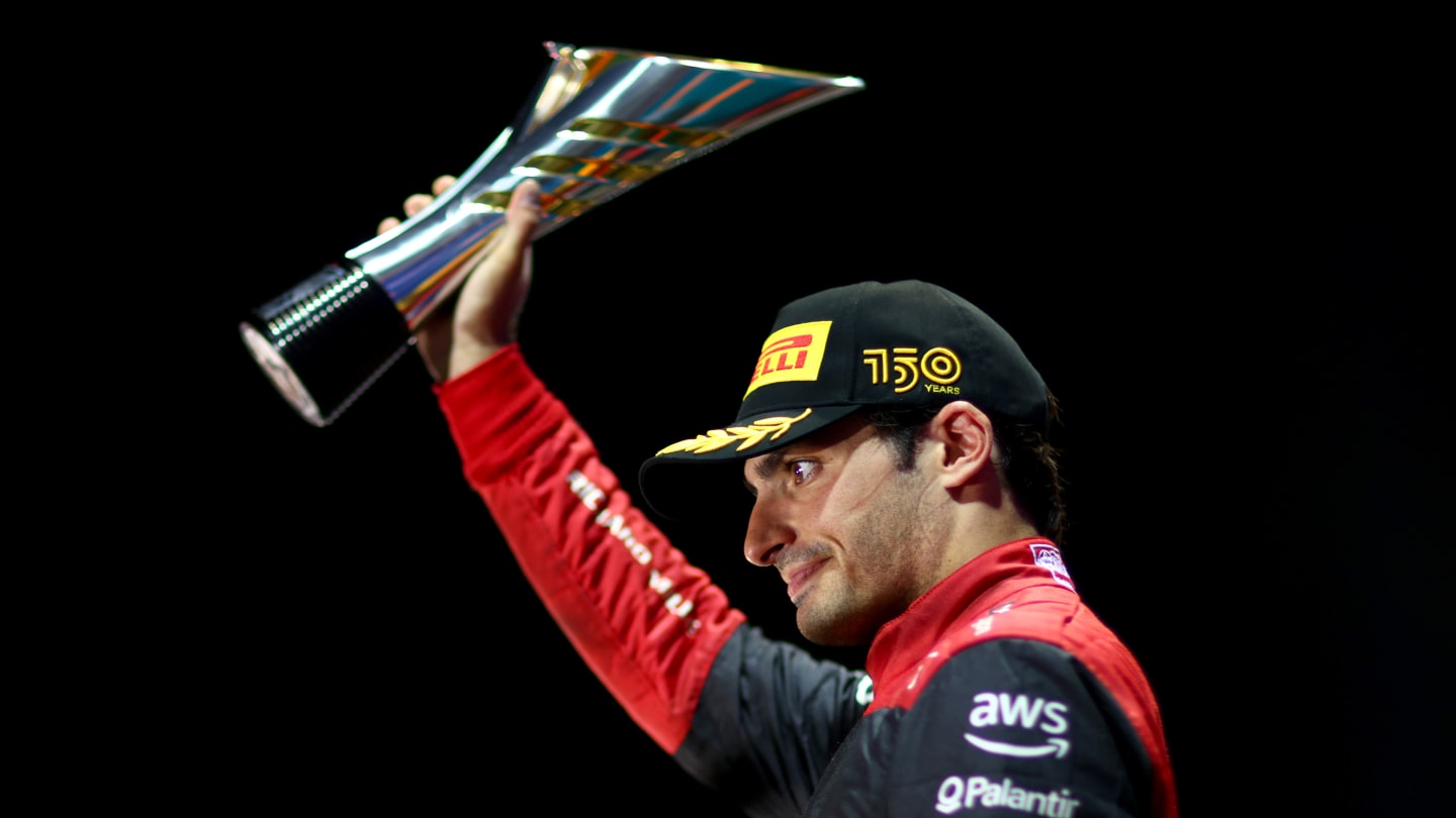 SINGAPORE, SINGAPORE - OCTOBER 02: Third placed Carlos Sainz of Spain and Ferrari celebrates on the