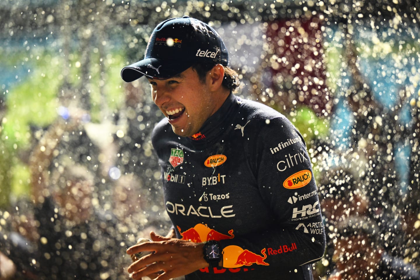 SINGAPORE, SINGAPORE - OCTOBER 02: Race winner Sergio Perez of Mexico and Oracle Red Bull Racing