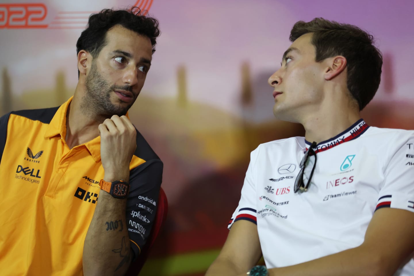 BARCELONA, SPAIN - MAY 20: Daniel Ricciardo of Australia and McLaren talks with George Russell of Great Britain and Mercedes in the Drivers Press Conference prior to practice ahead of the F1 Grand Prix of Spain at Circuit de Barcelona-Catalunya on May 20, 2022 in Barcelona, Spain. (Photo by Bryn Lennon/Getty Images)