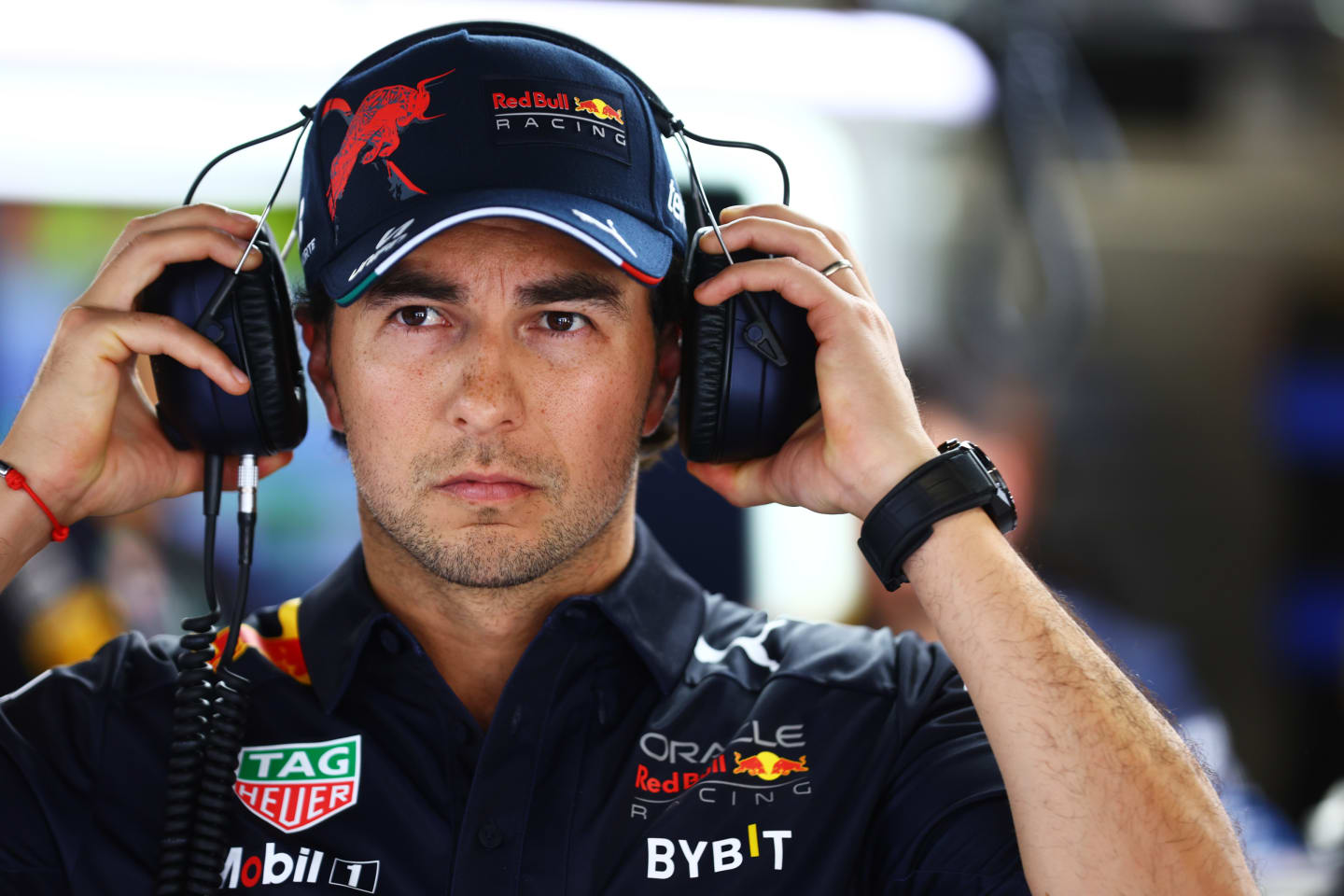 BARCELONA, SPAIN - MAY 20: Sergio Perez of Mexico and Oracle Red Bull Racing looks on in the garage