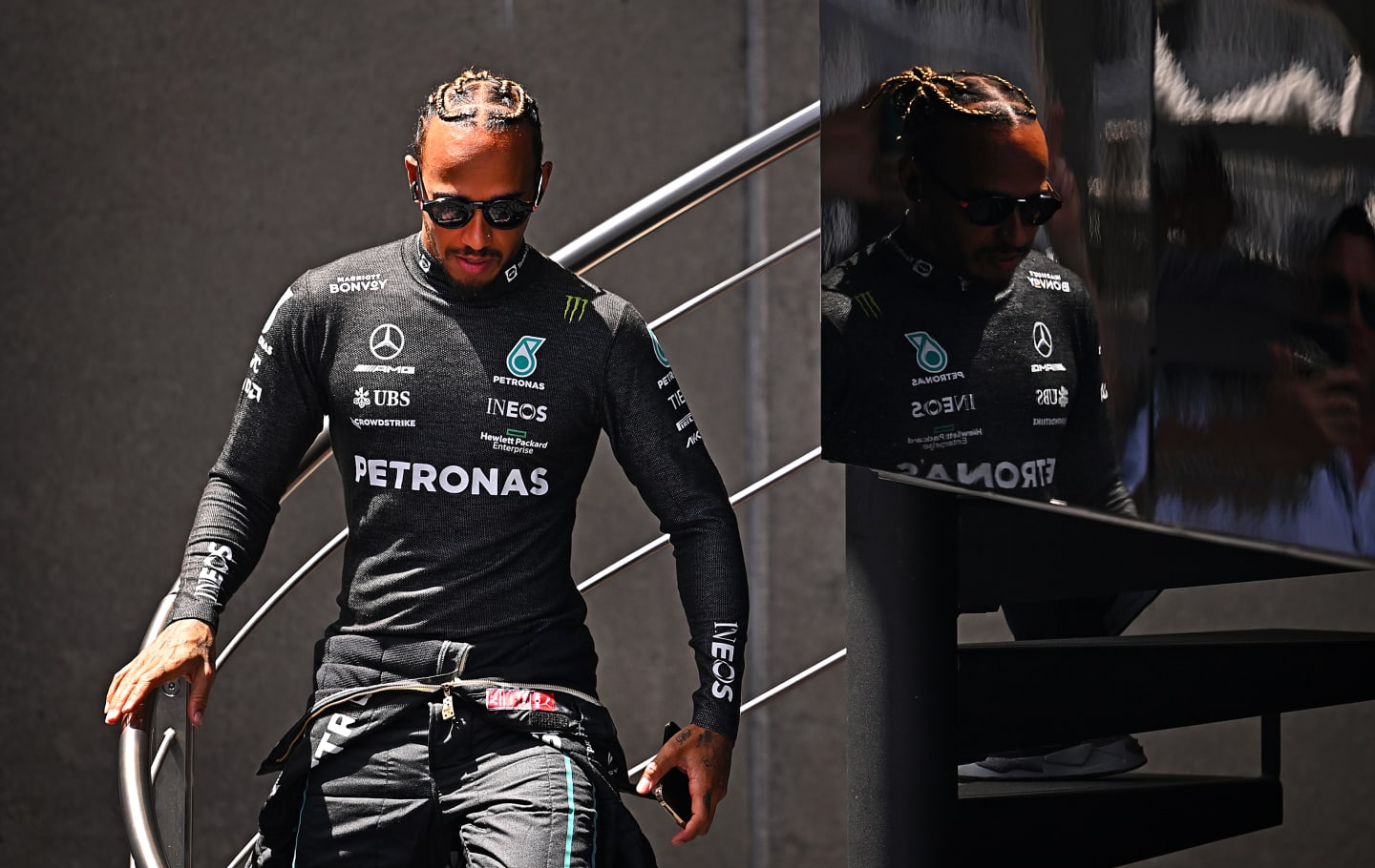 BARCELONA, SPAIN - MAY 21: Lewis Hamilton of Great Britain and Mercedes walks in the Paddock during