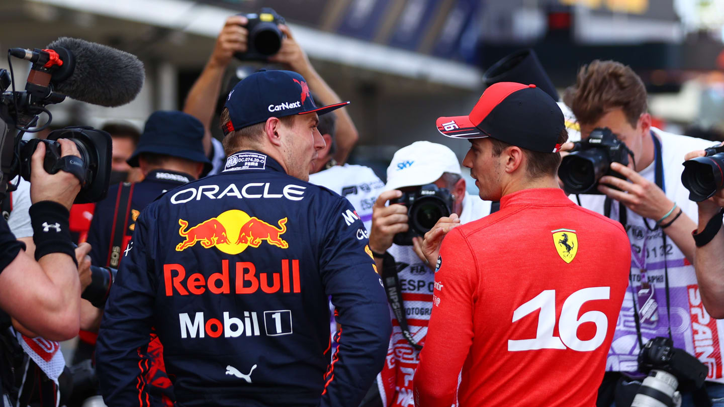 BARCELONA, SPAIN - MAY 21: Pole position qualifier Charles Leclerc of Monaco and Ferrari and Second placed qualifier Max Verstappen of the Netherlands and Oracle Red Bull Racing talk in parc ferme during qualifying ahead of the F1 Grand Prix of Spain at Circuit de Barcelona-Catalunya on May 21, 2022 in Barcelona, Spain. (Photo by Dan Istitene - Formula 1/Formula 1 via Getty Images)