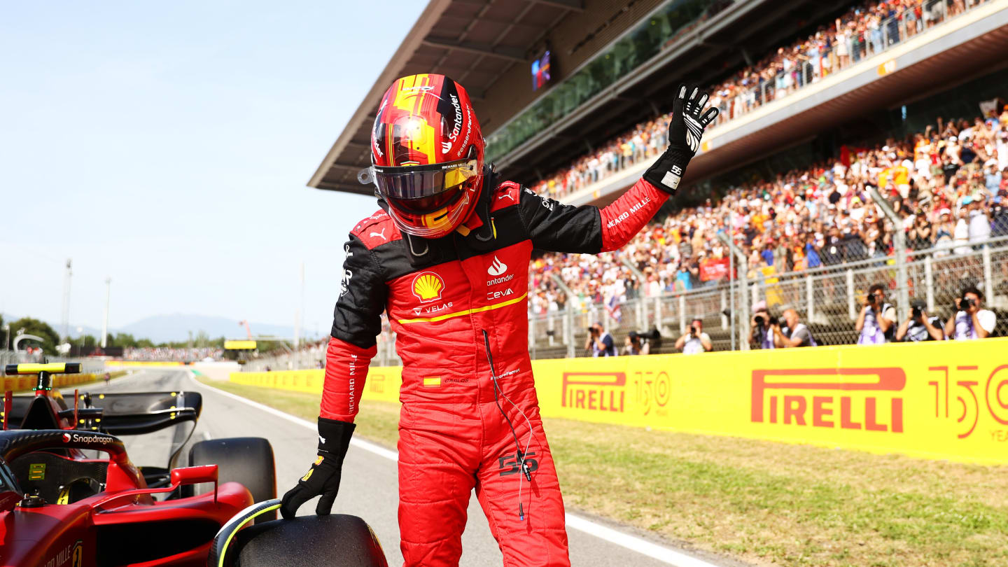 BARCELONA, SPAIN - MAY 21: Third placed qualifier Carlos Sainz of Spain and Ferrari waves to the crowd from parc ferme during qualifying ahead of the F1 Grand Prix of Spain at Circuit de Barcelona-Catalunya on May 21, 2022 in Barcelona, Spain. (Photo by Dan Istitene - Formula 1/Formula 1 via Getty Images)