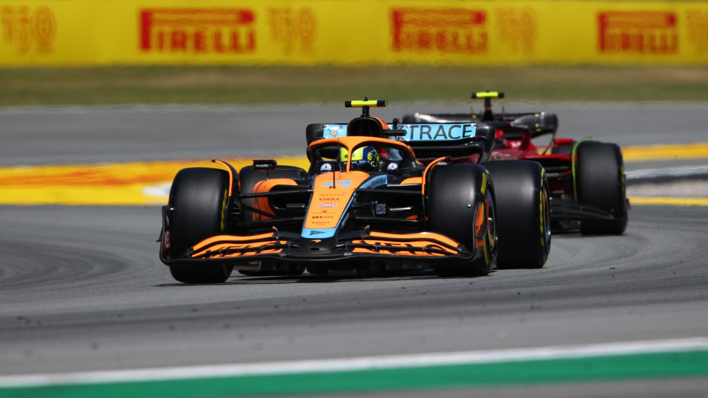 BARCELONA, SPAIN - MAY 22: Lando Norris of Great Britain driving the (4) McLaren MCL36 Mercedes leads Carlos Sainz of Spain driving (55) the Ferrari F1-75 during the F1 Grand Prix of Spain at Circuit de Barcelona-Catalunya on May 22, 2022 in Barcelona, Spain. (Photo by Joe Portlock - Formula 1/Formula 1 via Getty Images)