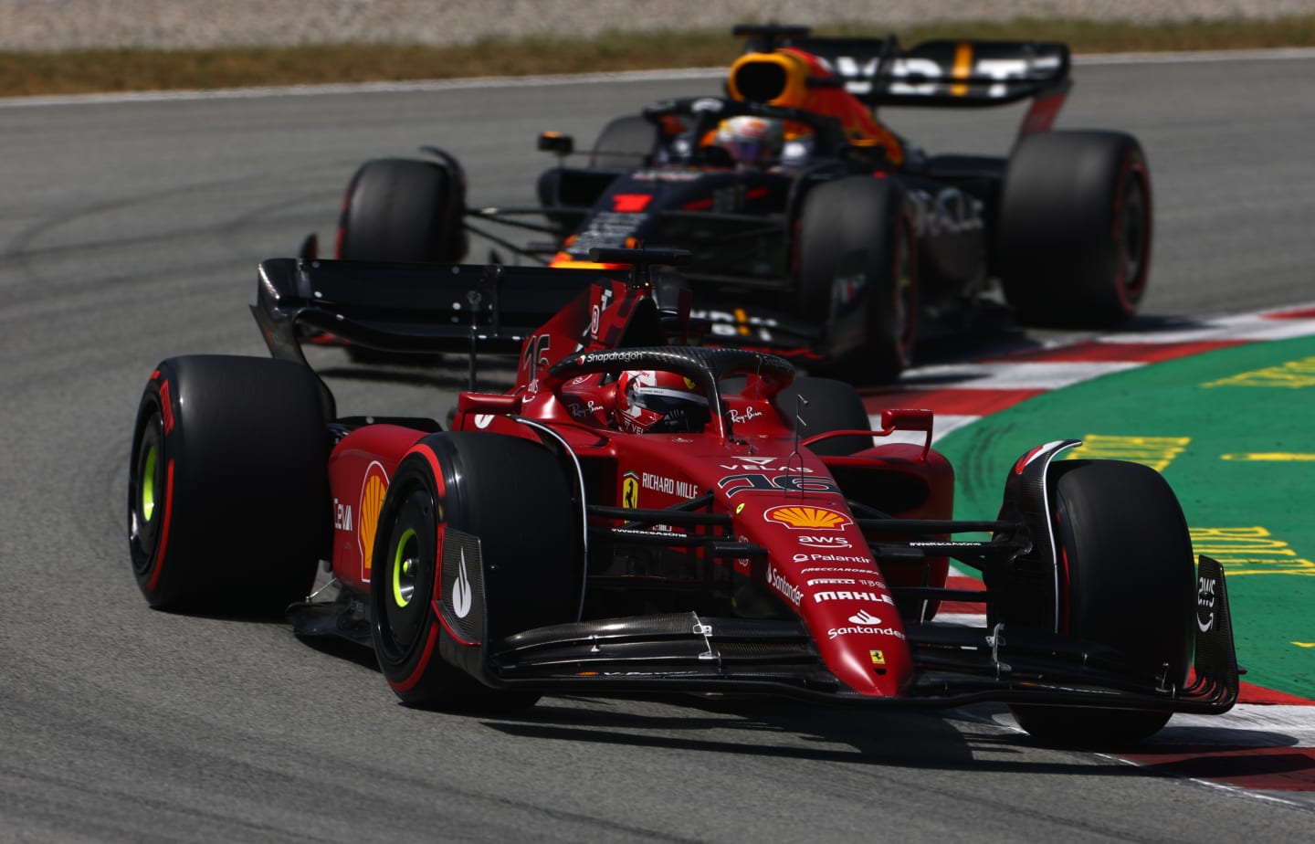 BARCELONA, SPAIN - MAY 22: Charles Leclerc of Monaco driving the (16) Ferrari F1-75 leads Max