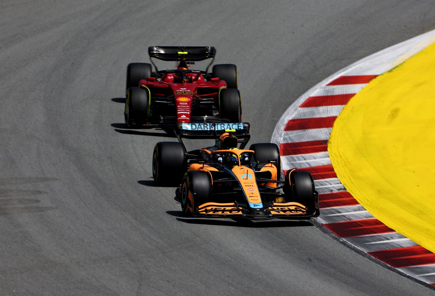 BARCELONA, SPAIN - MAY 22: Lando Norris of Great Britain driving the (4) McLaren MCL36 Mercedes leads Carlos Sainz of Spain driving (55) the Ferrari F1-75 during the F1 Grand Prix of Spain at Circuit de Barcelona-Catalunya on May 22, 2022 in Barcelona, Spain. (Photo by Lars Baron/Getty Images)