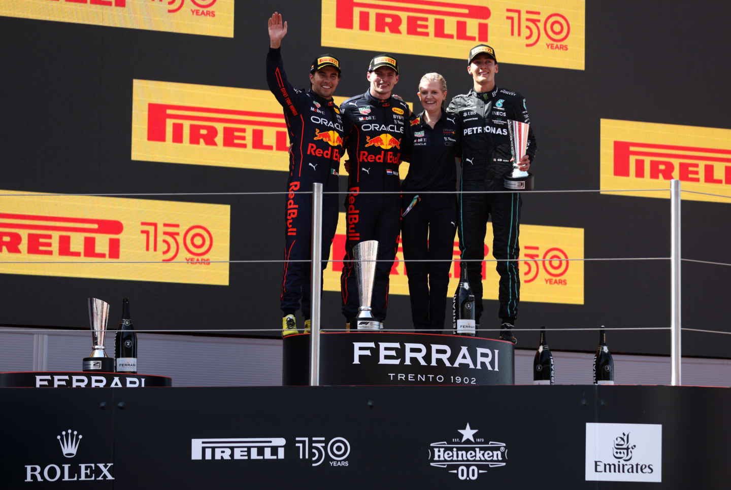BARCELONA, SPAIN - MAY 22: Race winner Max Verstappen of the Netherlands and Oracle Red Bull Racing, Second placed Sergio Perez of Mexico and Oracle Red Bull Racing and Third placed George Russell of Great Britain and Mercedes celebrate on the podium during the F1 Grand Prix of Spain at Circuit de Barcelona-Catalunya on May 22, 2022 in Barcelona, Spain. (Photo by Alex Pantling - Formula 1/Formula 1 via Getty Images)