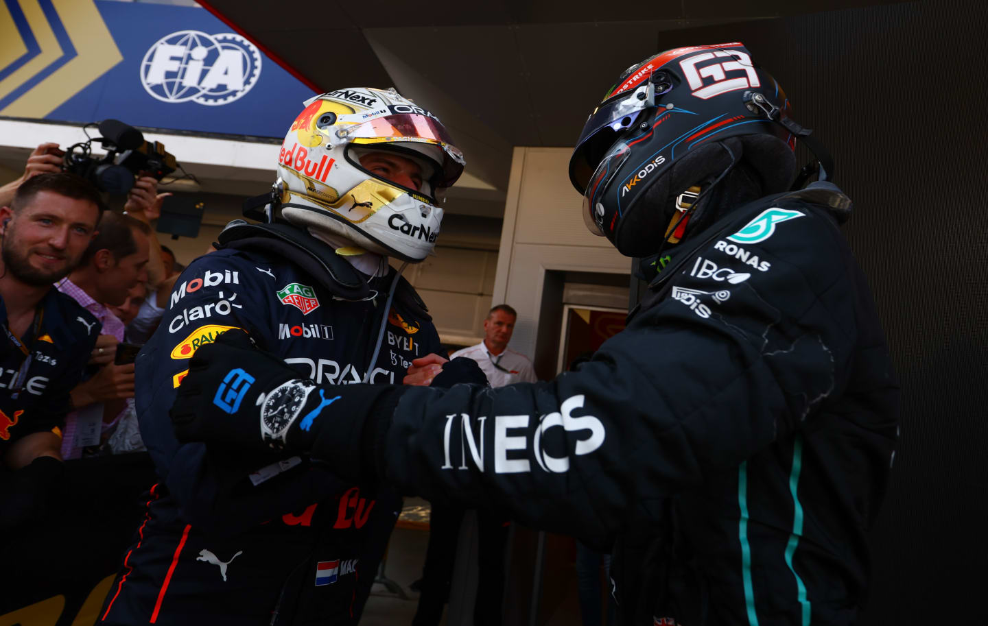 BARCELONA, SPAIN - MAY 22: Race winner Max Verstappen of the Netherlands and Oracle Red Bull Racing interacts with third placed George Russell of Great Britain and Mercedes in parc ferme during the F1 Grand Prix of Spain at Circuit de Barcelona-Catalunya on May 22, 2022 in Barcelona, Spain. (Photo by Mark Thompson/Getty Images)