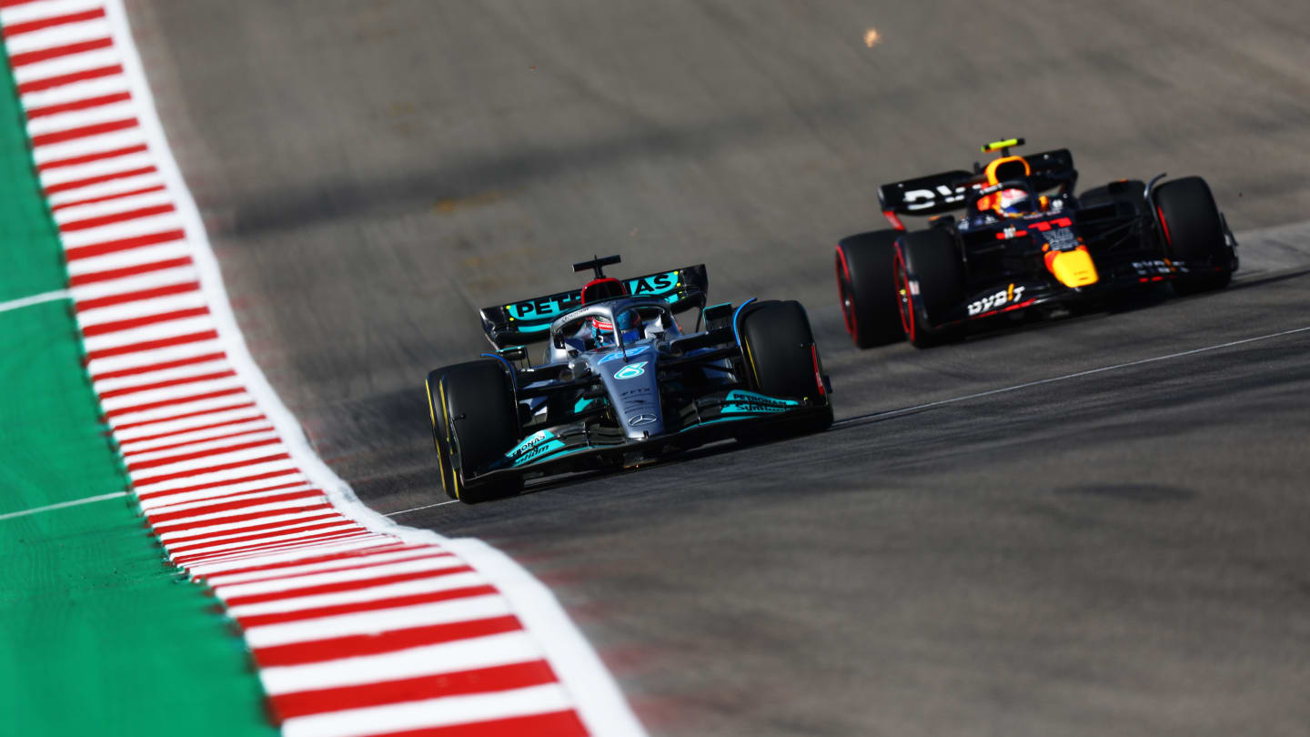 AUSTIN, TEXAS - OCTOBER 21: George Russell of Great Britain driving the (63) Mercedes AMG Petronas F1 Team W13 leads Sergio Perez of Mexico driving the (11) Oracle Red Bull Racing RB18 during practice ahead of the F1 Grand Prix of USA at Circuit of The Americas on October 21, 2022 in Austin, Texas. (Photo by Dan Istitene - Formula 1/Formula 1 via Getty Images)