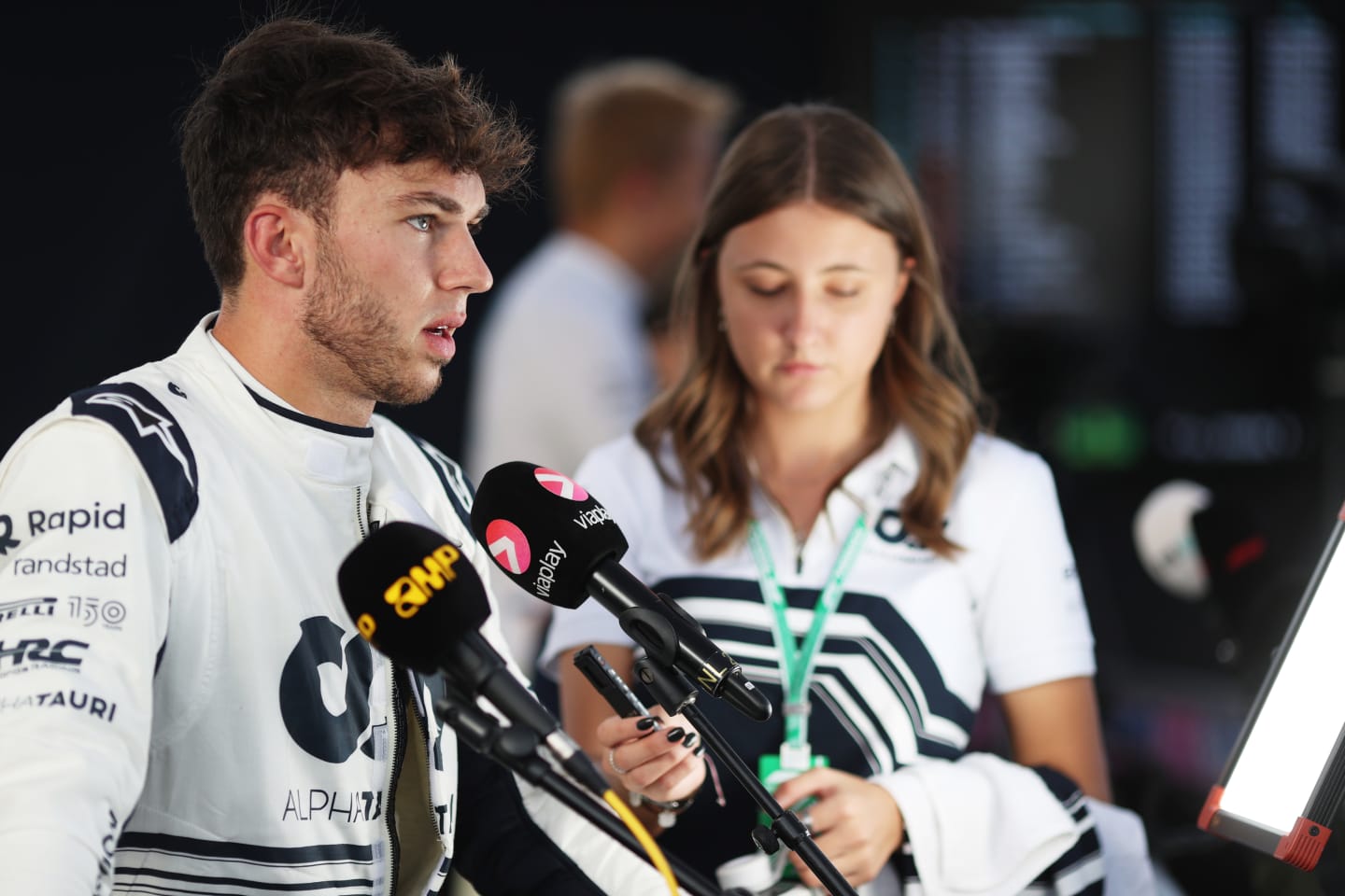 AUSTIN, TEXAS - OCTOBER 22: Thirteenth placed qualifier Pierre Gasly of France and Scuderia AlphaTauri talks to the media in the Paddock during qualifying ahead of the F1 Grand Prix of USA at Circuit of The Americas on October 22, 2022 in Austin, Texas. (Photo by Peter Fox/Getty Images)