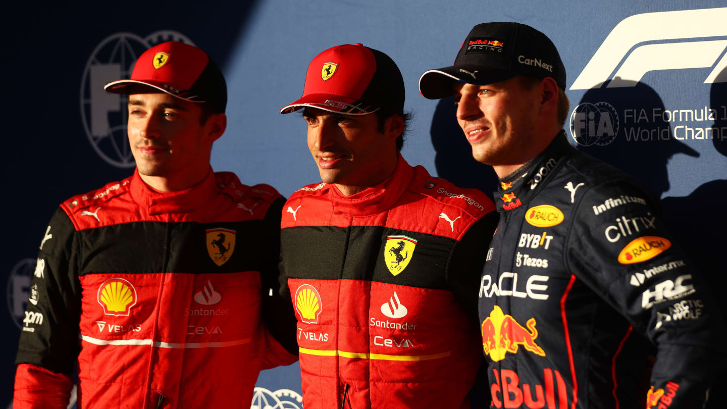 AUSTIN, TEXAS - OCTOBER 22: Pole position qualifier Carlos Sainz of Spain and Ferrari (C), Second placed qualifier Charles Leclerc of Monaco and Ferrari (L) and Third placed qualifier Max Verstappen of the Netherlands and Oracle Red Bull Racing (R) pose for a photo in parc ferme during qualifying ahead of the F1 Grand Prix of USA at Circuit of The Americas on October 22, 2022 in Austin, Texas. (Photo by Dan Istitene - Formula 1/Formula 1 via Getty Images)