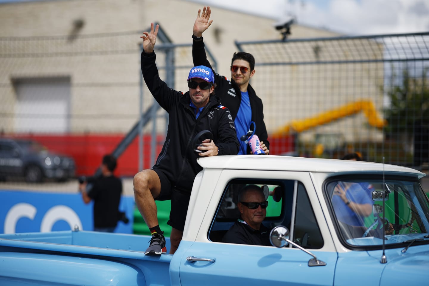 AUSTIN, TEXAS - OCTOBER 23: Fernando Alonso of Spain and Alpine F1 and Esteban Ocon of France and Alpine F1 wave to the crowd on the drivers parade prior to the F1 Grand Prix of USA at Circuit of The Americas on October 23, 2022 in Austin, Texas. (Photo by Chris Graythen/Getty Images)
