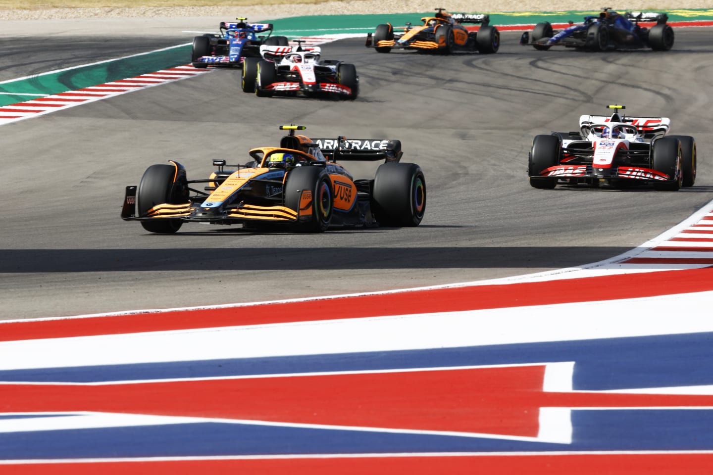 AUSTIN, TEXAS - OCTOBER 23: Lando Norris of Great Britain driving the (4) McLaren MCL36 Mercedes leads Mick Schumacher of Germany driving the (47) Haas F1 VF-22 Ferrari on track during the F1 Grand Prix of USA at Circuit of The Americas on October 23, 2022 in Austin, Texas. (Photo by Chris Graythen/Getty Images)