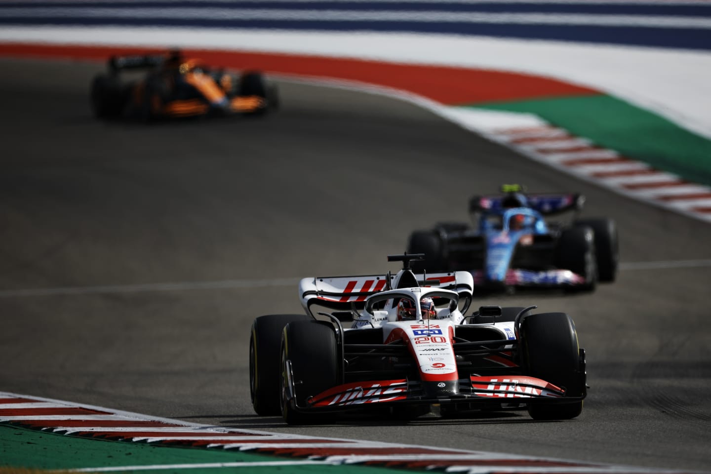 AUSTIN, TEXAS - OCTOBER 23: Kevin Magnussen of Denmark driving the (20) Haas F1 VF-22 Ferrari leads