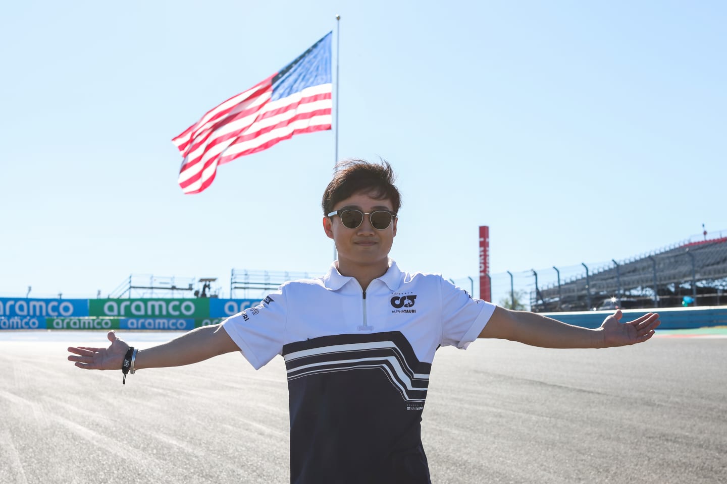 AUSTIN, TEXAS - OCTOBER 20: Yuki Tsunoda of Japan and Scuderia AlphaTauri poses for a photo on a