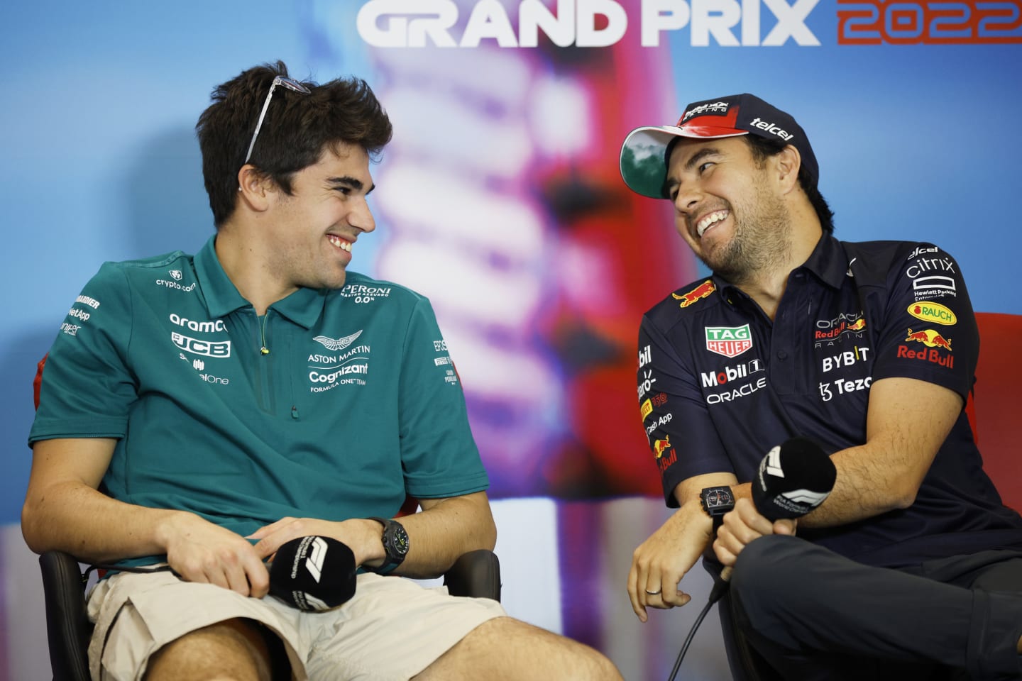 AUSTIN, TEXAS - OCTOBER 20: Lance Stroll of Canada and Aston Martin F1 Team and Sergio Perez of Mexico and Oracle Red Bull Racing talk in the Drivers Press Conference during previews ahead of the F1 Grand Prix of USA at Circuit of The Americas on October 20, 2022 in Austin, Texas. (Photo by Jared C. Tilton/Getty Images)