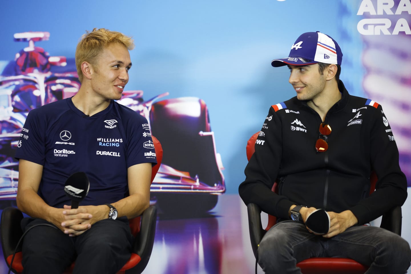 AUSTIN, TEXAS - OCTOBER 20: Alexander Albon of Thailand and Williams and Esteban Ocon of France and Alpine F1 talk in the Drivers Press Conference during previews ahead of the F1 Grand Prix of USA at Circuit of The Americas on October 20, 2022 in Austin, Texas. (Photo by Jared C. Tilton/Getty Images)