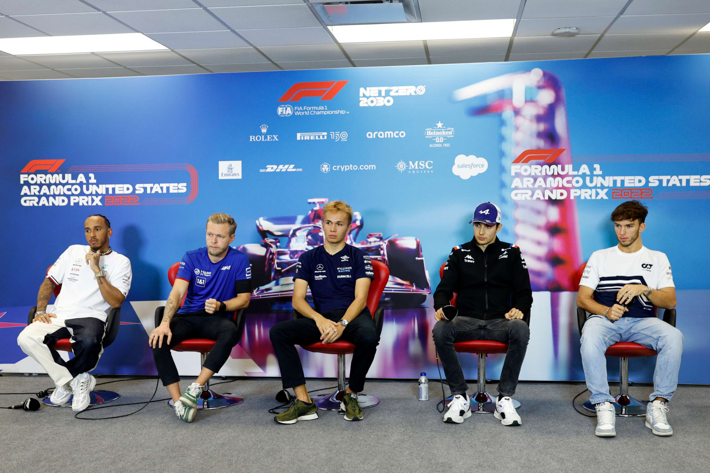 AUSTIN, TEXAS - OCTOBER 20: (L-R) Lewis Hamilton of Great Britain and Mercedes, Kevin Magnussen of Denmark and Haas F1, Alexander Albon of Thailand and Williams, Esteban Ocon of France and Alpine F1 and Pierre Gasly of France and Scuderia AlphaTauri attend the Drivers Press Conference during previews ahead of the F1 Grand Prix of USA at Circuit of The Americas on October 20, 2022 in Austin, Texas. (Photo by Jared C. Tilton/Getty Images)