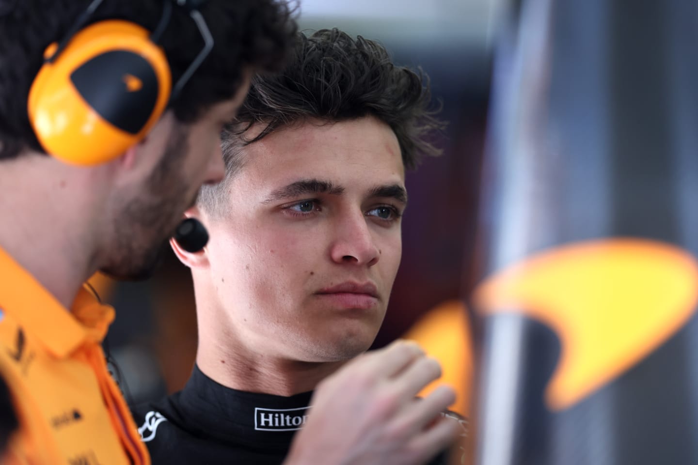 BAHRAIN, BAHRAIN - MARCH 03: Lando Norris of Great Britain driving the (4) McLaren MCL60 Mercedes looks on in the garage during practice ahead of the F1 Grand Prix of Bahrain at Bahrain International Circuit on March 03, 2023 in Bahrain, Bahrain. (Photo by Lars Baron/Getty Images)