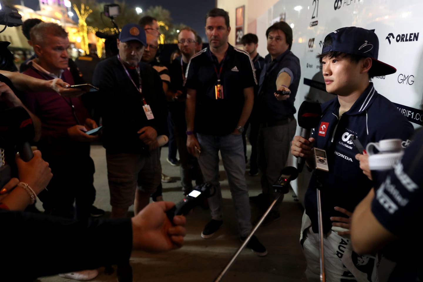 BAHRAIN, BAHRAIN - MARCH 03: Yuki Tsunoda of Japan and Scuderia AlphaTauri talks to the media in the Paddock after practice ahead of the F1 Grand Prix of Bahrain at Bahrain International Circuit on March 03, 2023 in Bahrain, Bahrain. (Photo by Peter Fox/Getty Images)