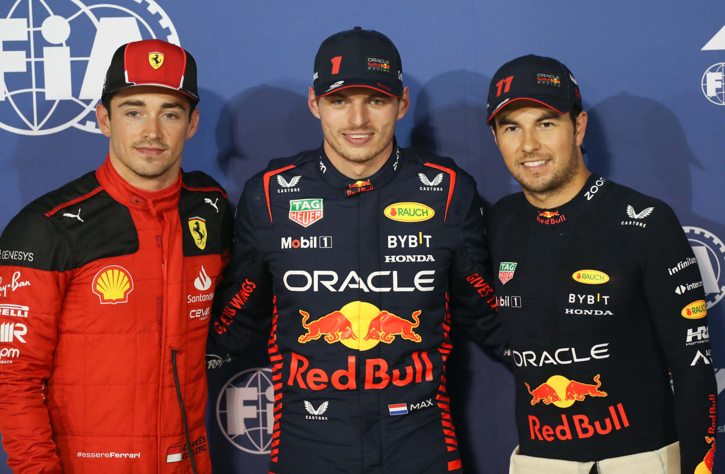 BAHRAIN, BAHRAIN - MARCH 04: Pole position qualifier Max Verstappen of the Netherlands and Oracle Red Bull Racing (C), Second placed qualifier Sergio Perez of Mexico and Oracle Red Bull Racing (R) and Third placed qualifier Charles Leclerc of Monaco and Ferrari (L) pose for a photo in parc ferme during qualifying ahead of the F1 Grand Prix of Bahrain at Bahrain International Circuit on March 04, 2023 in Bahrain, Bahrain. (Photo by Peter Fox/Getty Images)