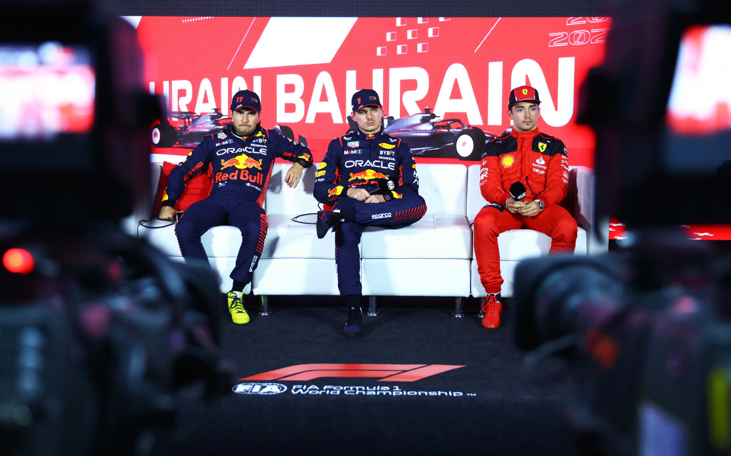 BAHRAIN, BAHRAIN - MARCH 04: Pole position qualifier Max Verstappen of the Netherlands and Oracle Red Bull Racing (C), Second placed qualifier Sergio Perez of Mexico and Oracle Red Bull Racing (L) and Third placed qualifier Charles Leclerc of Monaco and Ferrari (R) attend the press conference after qualifying ahead of the F1 Grand Prix of Bahrain at Bahrain International Circuit on March 04, 2023 in Bahrain, Bahrain. (Photo by Dan Istitene/Getty Images)