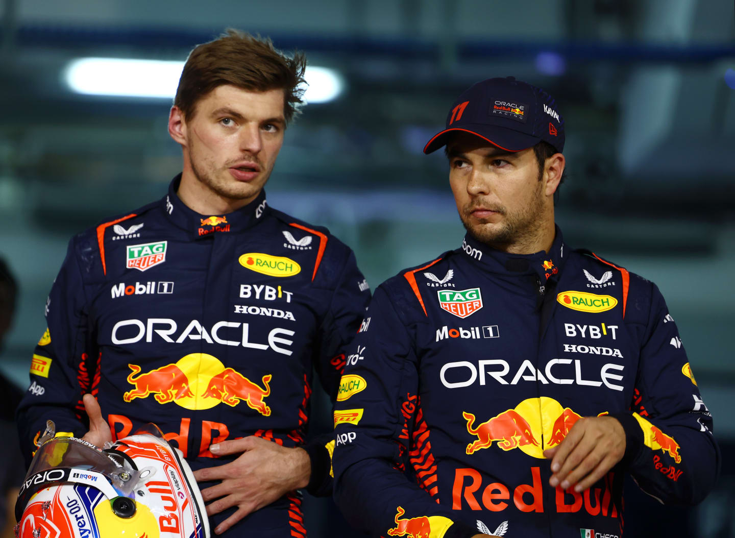 BAHRAIN, BAHRAIN - MARCH 04: Pole position qualifier Max Verstappen of the Netherlands and Oracle Red Bull Racing and Second placed qualifier Sergio Perez of Mexico and Oracle Red Bull Racing talk in parc ferme during qualifying ahead of the F1 Grand Prix of Bahrain at Bahrain International Circuit on March 04, 2023 in Bahrain, Bahrain. (Photo by Mark Thompson/Getty Images)