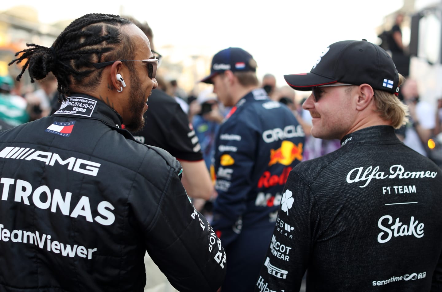 BAHRAIN, BAHRAIN - MARCH 05: Lewis Hamilton of Great Britain and Mercedes talks with Valtteri Bottas of Finland and Alfa Romeo F1 prior to the F1 Grand Prix of Bahrain at Bahrain International Circuit on March 05, 2023 in Bahrain, Bahrain. (Photo by Peter Fox/Getty Images)