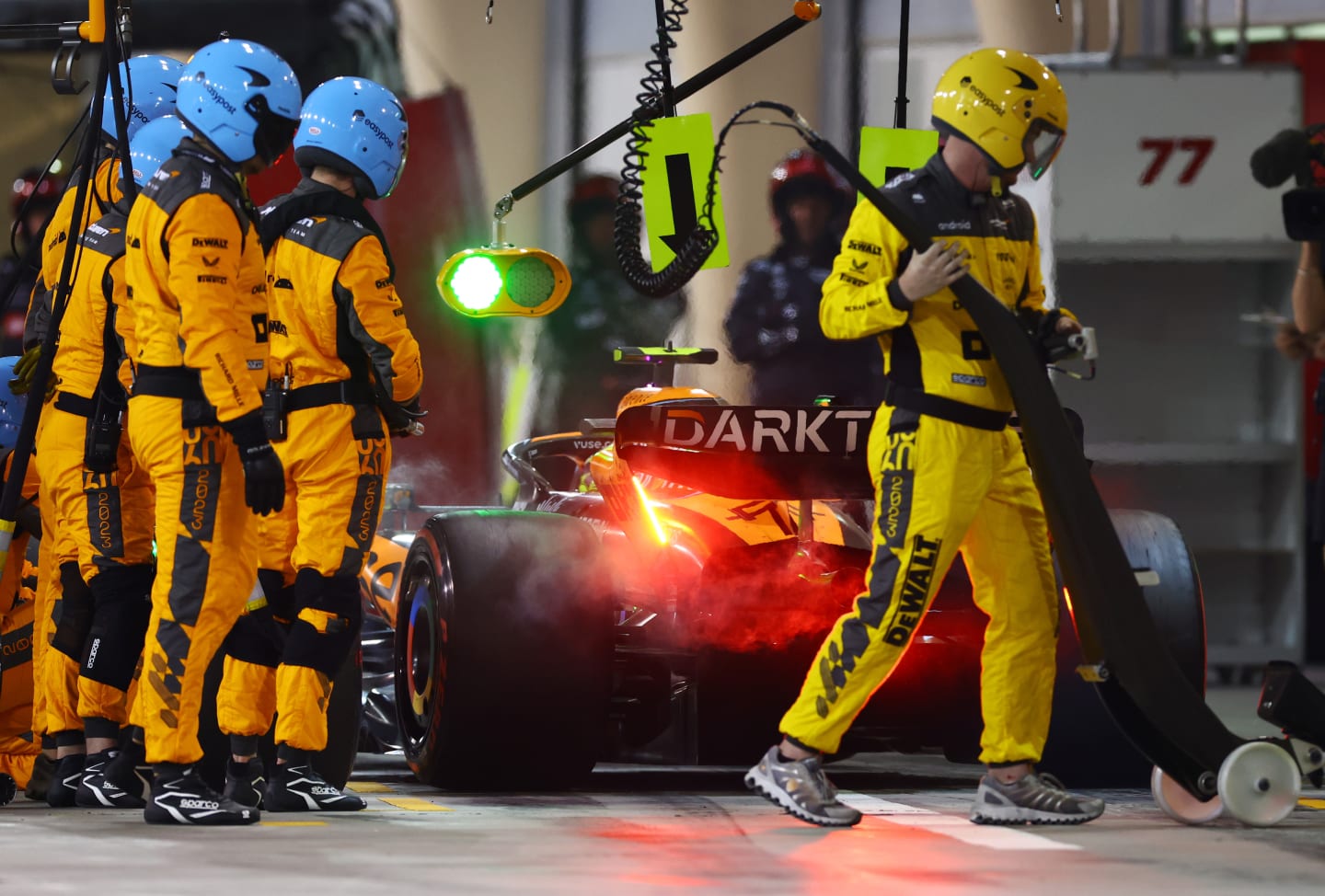 BAHRAIN, BAHRAIN - MARCH 05: Lando Norris of Great Britain driving the (4) McLaren MCL60 Mercedes makes a pitstop during the F1 Grand Prix of Bahrain at Bahrain International Circuit on March 05, 2023 in Bahrain, Bahrain. (Photo by Mark Thompson/Getty Images)