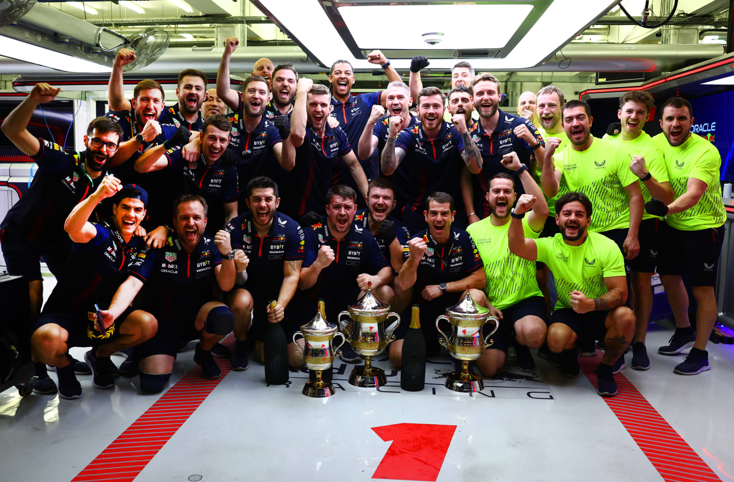 BAHRAIN, BAHRAIN - MARCH 05: The Red Bull Racing team celebrate in the garage after securing a 1-2 finish during the F1 Grand Prix of Bahrain at Bahrain International Circuit on March 05, 2023 in Bahrain, Bahrain. (Photo by Mark Thompson/Getty Images)