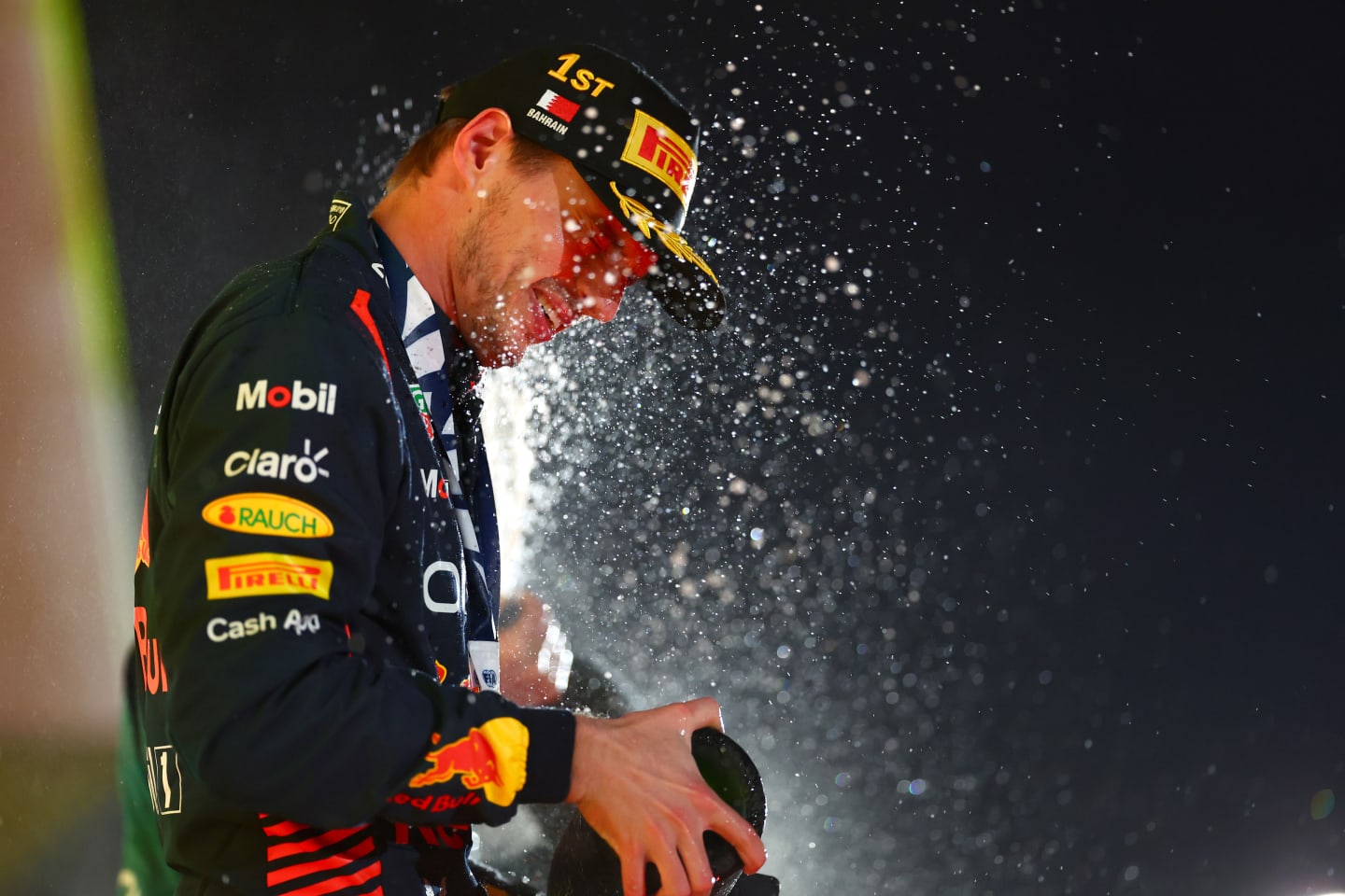 BAHRAIN, BAHRAIN - MARCH 05: Race winner Max Verstappen of the Netherlands and Oracle Red Bull Racing celebrates on the podium during the F1 Grand Prix of Bahrain at Bahrain International Circuit on March 05, 2023 in Bahrain, Bahrain. (Photo by Dan Istitene - Formula 1/Formula 1 via Getty Images)