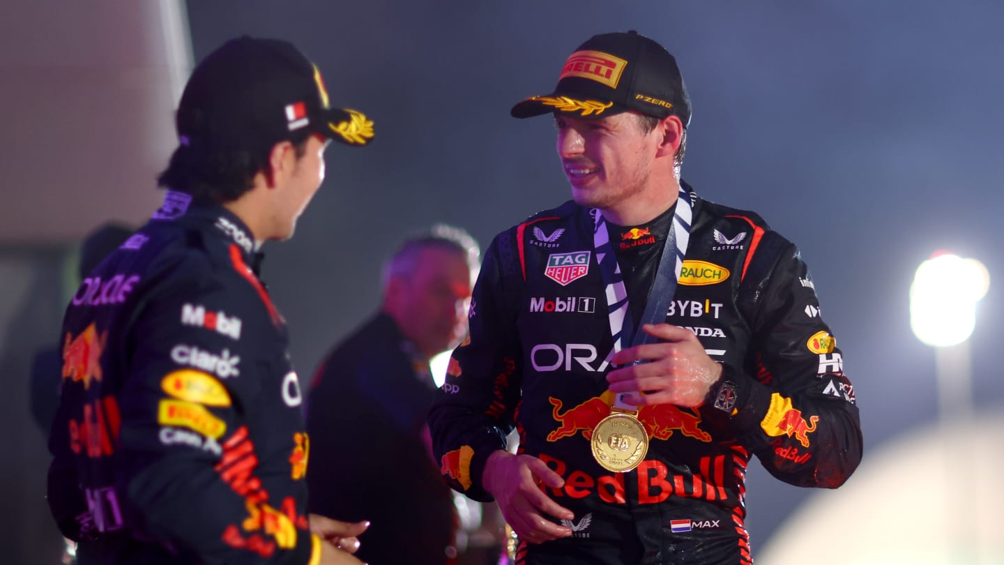 BAHRAIN, BAHRAIN - MARCH 05: Race winner Max Verstappen of the Netherlands and Oracle Red Bull Racing and Second placed Sergio Perez of Mexico and Oracle Red Bull Racing celebrate on the podium during the F1 Grand Prix of Bahrain at Bahrain International Circuit on March 05, 2023 in Bahrain, Bahrain. (Photo by Dan Istitene - Formula 1/Formula 1 via Getty Images)