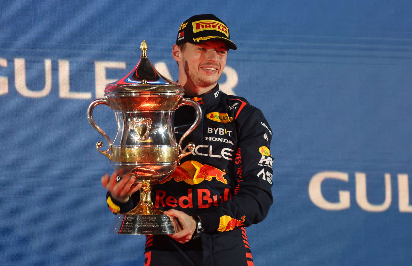 BAHRAIN, BAHRAIN - MARCH 05: Race winner Max Verstappen of the Netherlands and Oracle Red Bull Racing celebrates on the podium during the F1 Grand Prix of Bahrain at Bahrain International Circuit on March 05, 2023 in Bahrain, Bahrain. (Photo by Lars Baron/Getty Images)