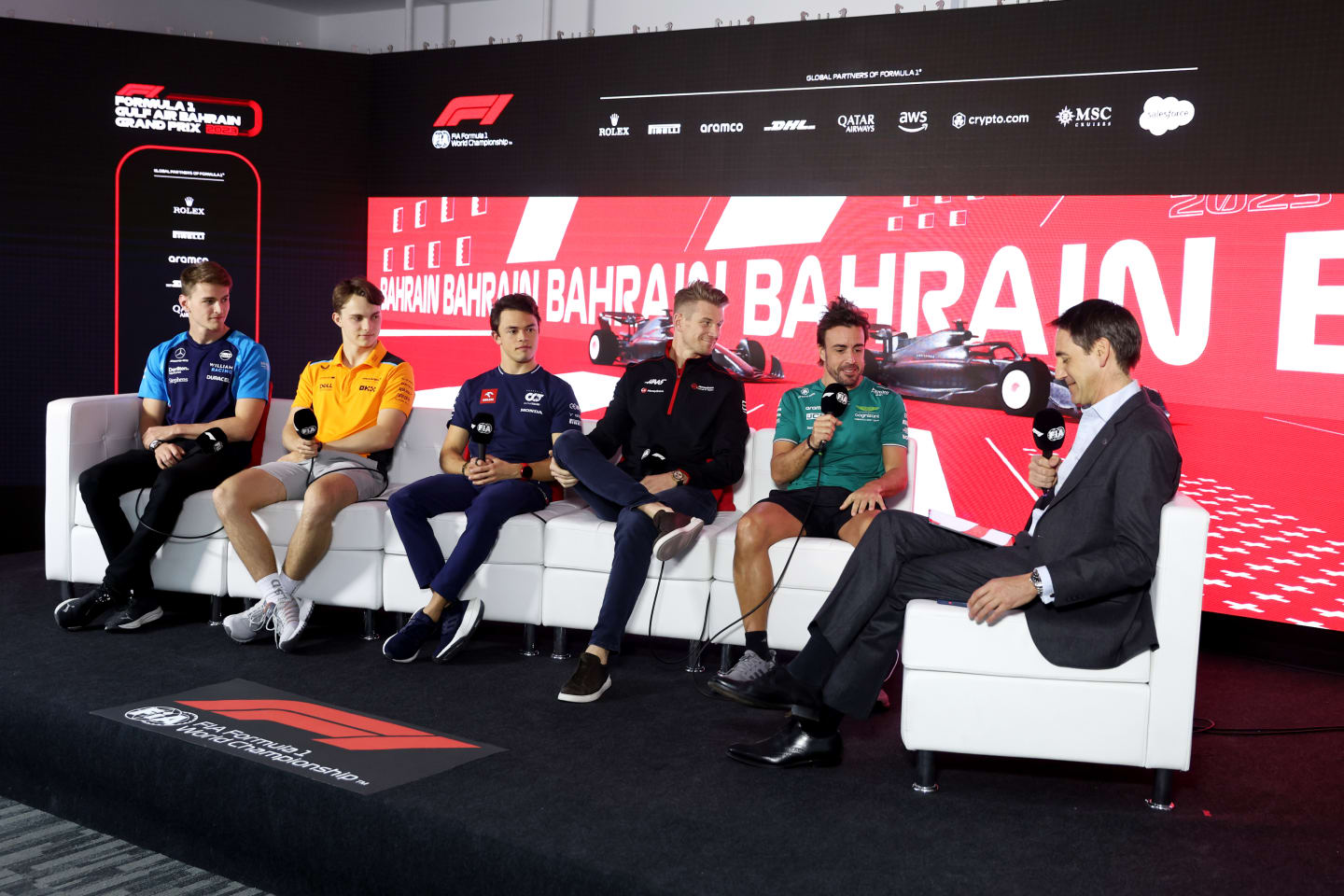 BAHRAIN, BAHRAIN - MARCH 02: (L-R) Logan Sargeant of United States and Williams, Oscar Piastri of Australia and McLaren, Nyck de Vries of Netherlands and Scuderia AlphaTauri, Nico Hulkenberg of Germany and Haas F1 and Fernando Alonso of Spain and Aston Martin F1 Team attend the Drivers Press Conference during previews ahead of the F1 Grand Prix of Bahrain at Bahrain International Circuit on March 02, 2023 in Bahrain, Bahrain. (Photo by Lars Baron/Getty Images)